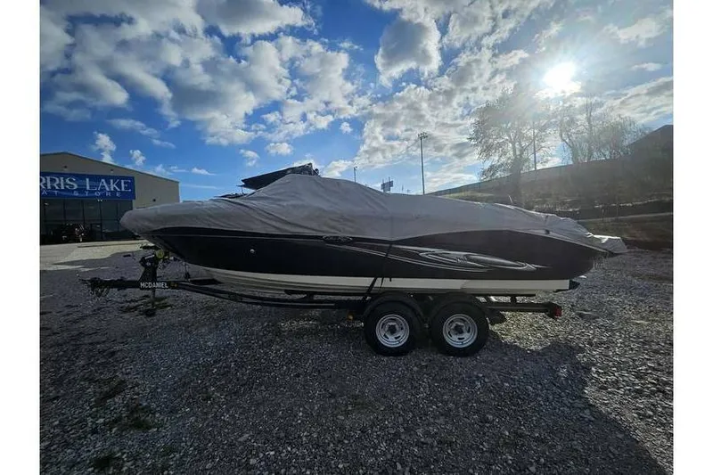 Slide: The Image of Covered 2006 Sea Ray 220 Select boat on trailer under a cloudy sky. - 5
