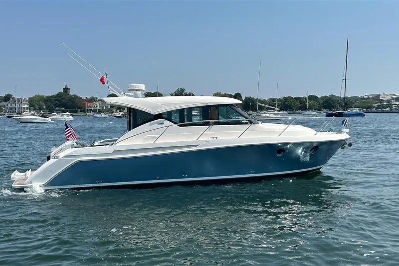 Slide: The Image of 2017 Tiara Yachts C39 Coupe cruising on a sunny day in a scenic harbor. - 2