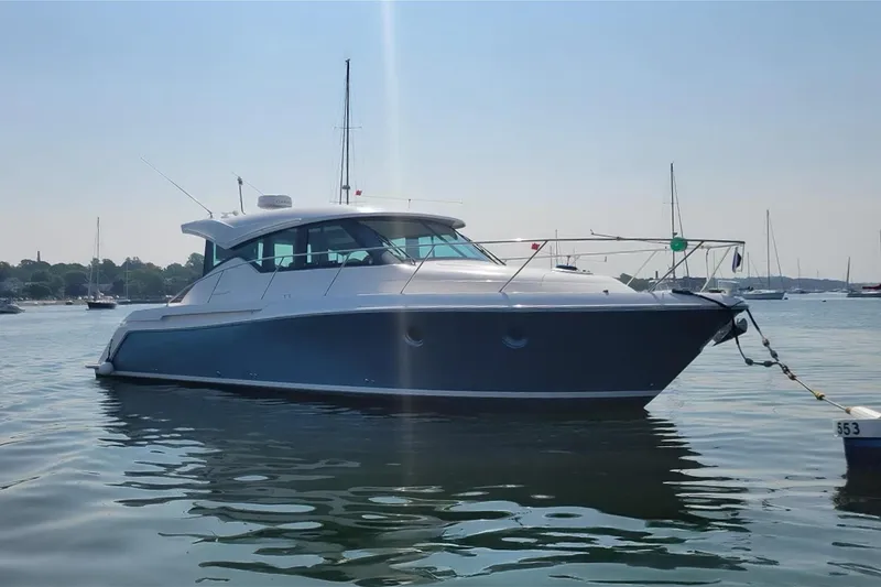 Slide: The Image of 2017 Tiara Yachts C39 Coupe anchored on calm water, side view. - 3