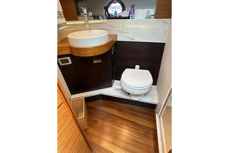 Slide: The Image of 2017 Tiara Yachts C39 Coupe bathroom with modern sink and toilet. - 15