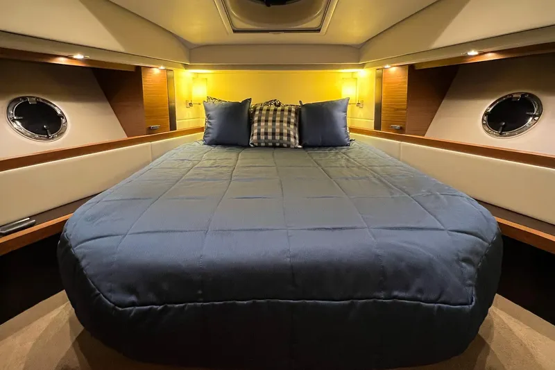 Slide: The Image of Luxurious cabin interior of 2017 Tiara Yachts C39 Coupe with cozy bedding. - 14