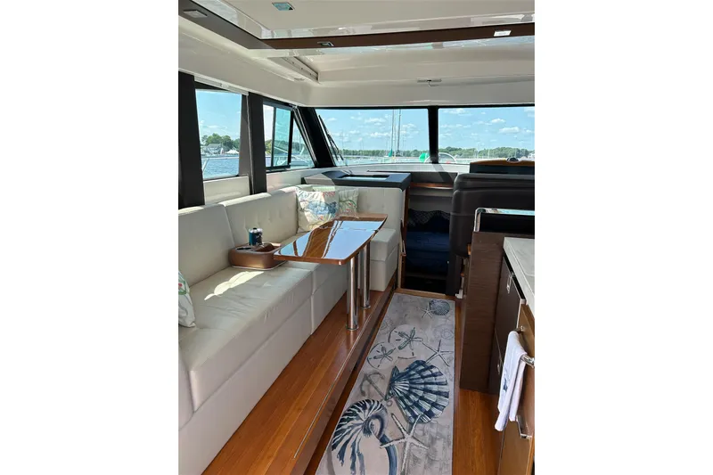 Slide: The Image of Luxurious interior of 2017 Tiara Yachts C39 Coupe with elegant seating and panoramic windows. - 10