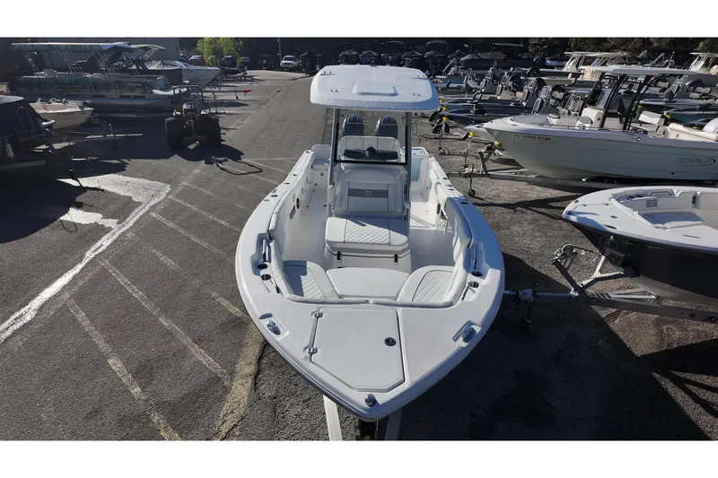 Slide: The Image of 2026 Sea Fox 268 Commander boat displayed in a marina, surrounded by other vessels. - 10