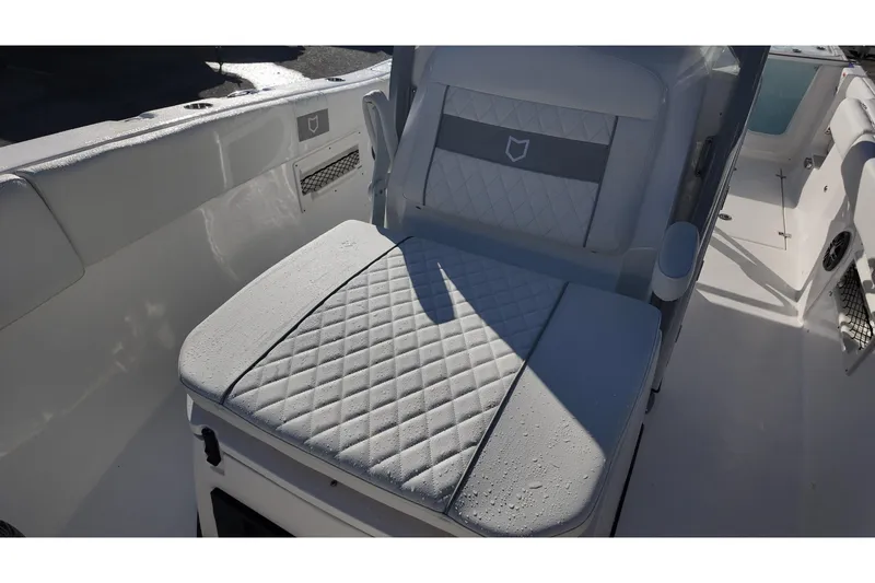 Slide: The Image of 2026 Sea Fox 268 Commander boat seat with diamond-pattern upholstery. - 13