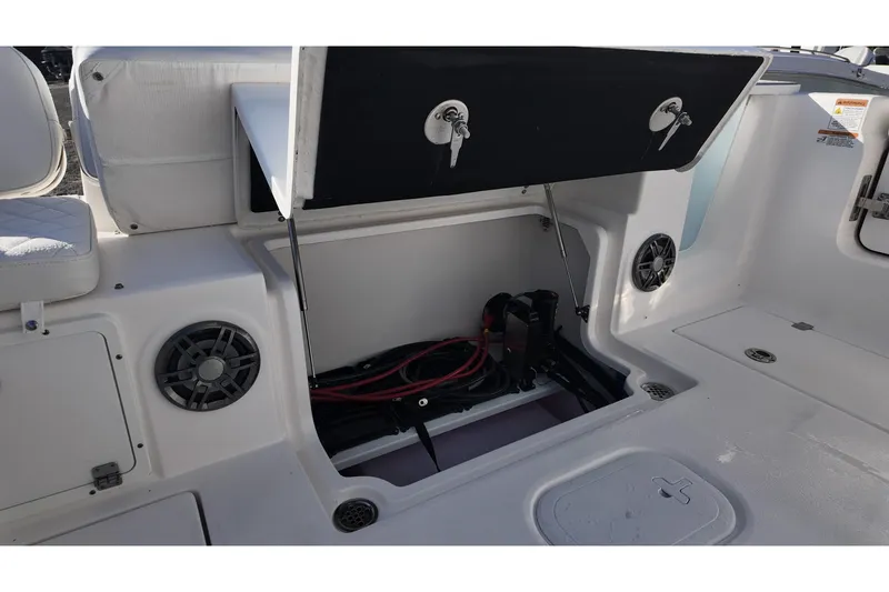 Slide: The Image of 2026 Sea Fox 268 Commander boat storage compartment with open hatch and visible wiring. - 18