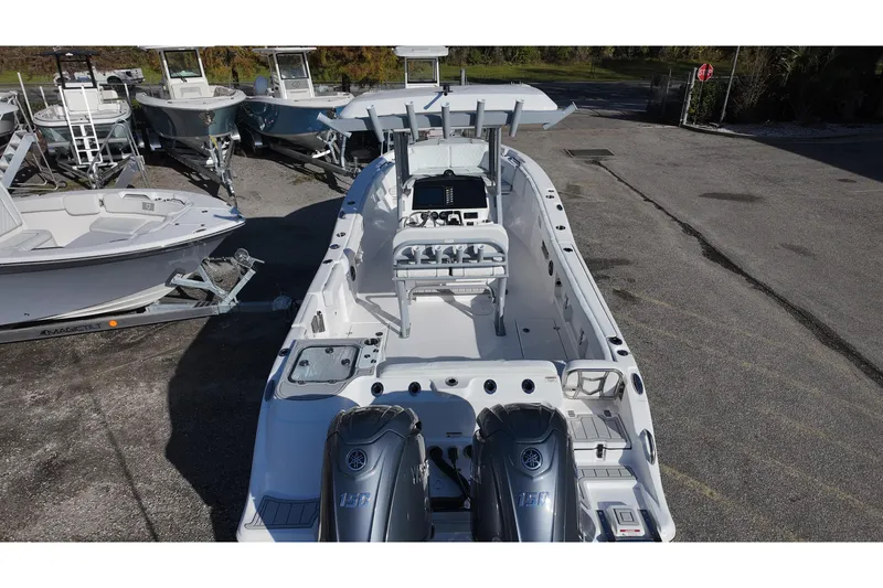 Slide: The Image of 2026 Sea Fox 268 Commander boat with dual engines, docked in a marina. - 20