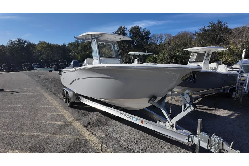Slide: The Image of 2026 Sea Fox 268 Commander boat on trailer, parked outdoors under clear sky. - 3