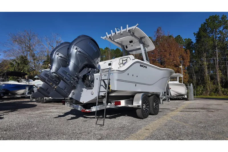 Slide: The Image of 2026 Sea Fox 268 Commander boat on trailer with dual Yamaha engines, parked outdoors. - 4