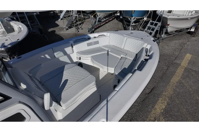 Slide: The Image of 2026 Sea Fox 268 Commander boat interior with cushioned seating and storage compartments. - 7
