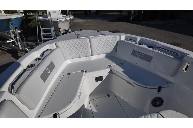 Slide: The Image of 2026 Sea Fox 268 Commander boat interior with cushioned seating and cup holders. - 9