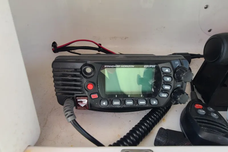 Slide: The Image of Standard Horizon Eclipse radio on 2005 Pro-Line 24 Sport boat dashboard. - 19