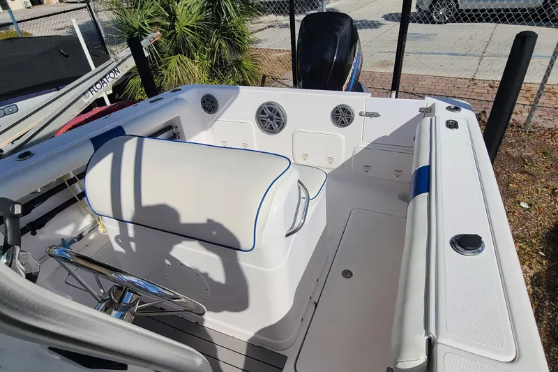 Slide: The Image of 2005 Pro-Line 24 Sport boat interior with seating and steering wheel. - 21