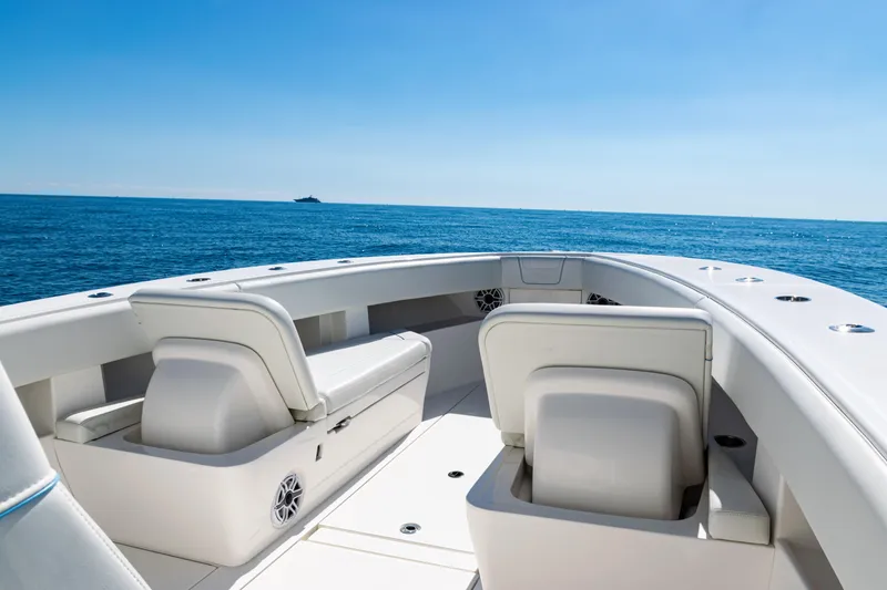 Slide: The Image of 2024 SeaVee 390B boat interior with ocean view, featuring sleek seating and modern design. - 11