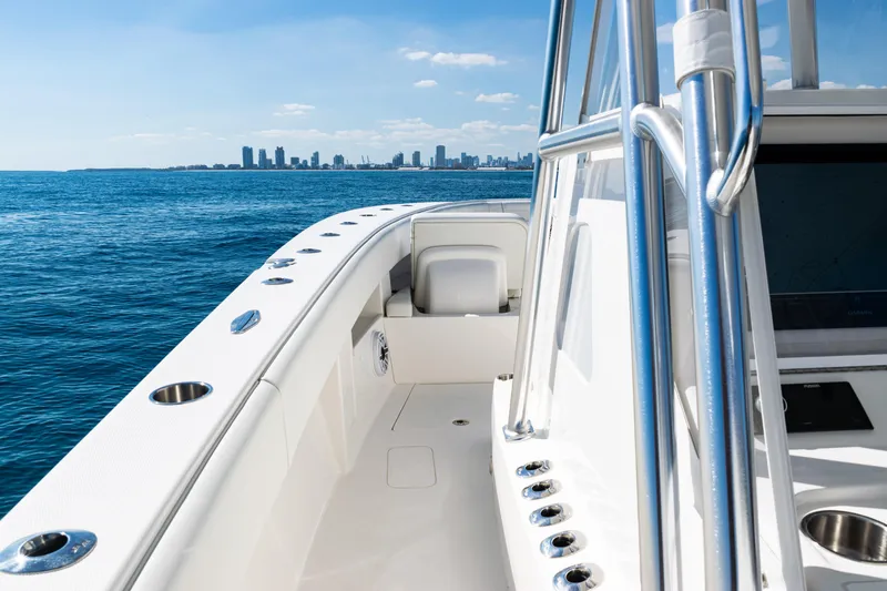 Slide: The Image of 2024 SeaVee 390B boat on ocean with city skyline in background. - 21