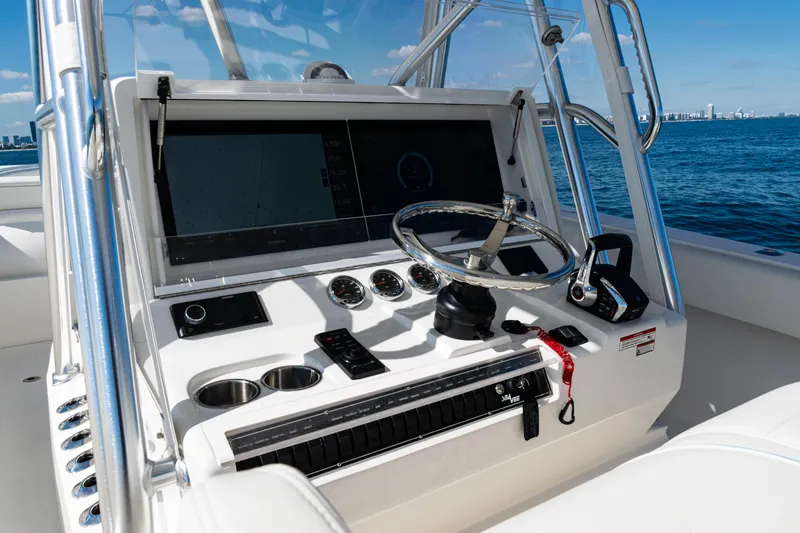 Slide: The Image of 2024 SeaVee 390B boat dashboard with steering wheel and navigation controls. - 24