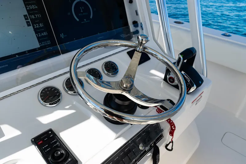 Slide: The Image of 2024 SeaVee 390B boat helm with modern controls and navigation displays. - 25