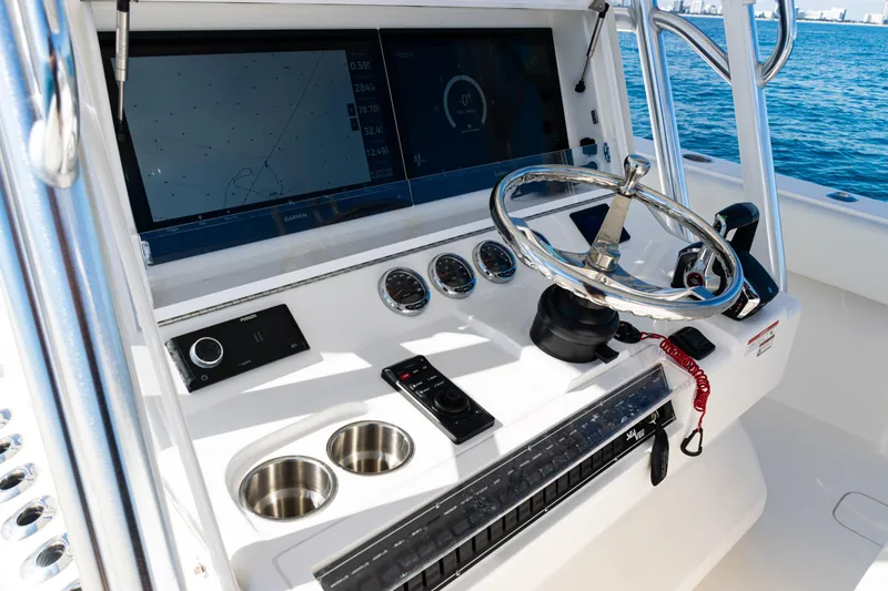 Slide: The Image of 2024 SeaVee 390B boat helm with modern navigation and control systems. - 26