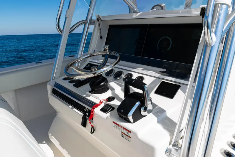 Slide: The Image of 2024 SeaVee 390B boat helm with modern controls and ocean view. - 27