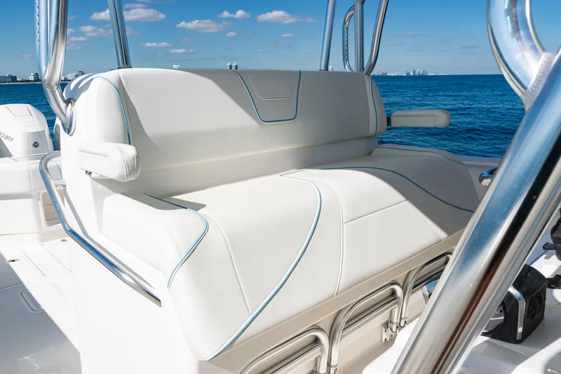 Slide: The Image of 2024 SeaVee 390B boat with luxurious seating, ocean backdrop, and clear blue sky. - 28