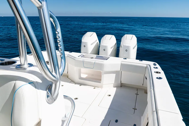 Slide: The Image of 2024 SeaVee 390B boat with triple Mercury engines on open ocean. - 33