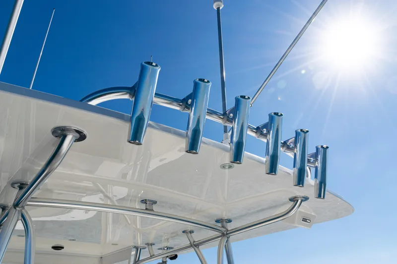 Slide: The Image of 2024 SeaVee 390B boat with rod holders under a clear blue sky. - 39