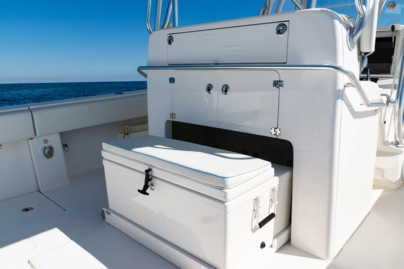 Slide: The Image of 2024 SeaVee 390B boat interior with storage and seating, ocean view. - 40
