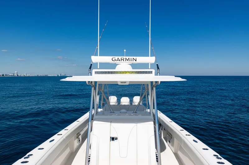 Slide: The Image of 2024 SeaVee 390B boat on open ocean with clear blue sky. - 42