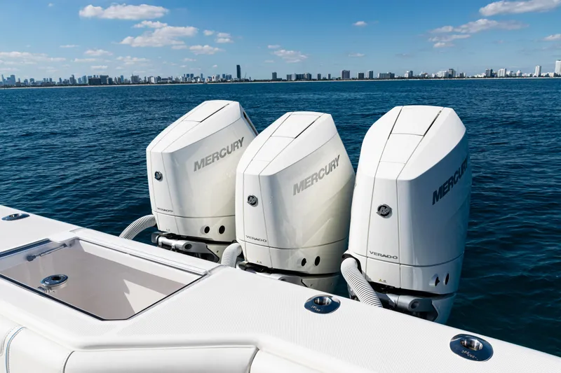 Slide: The Image of 2024 SeaVee 390B boat with triple Mercury Verado engines on open water. - 43