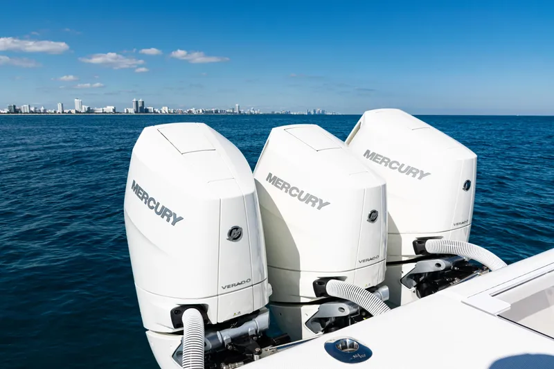 Slide: The Image of 2024 SeaVee 390B boat with triple Mercury Verado engines on open ocean. - 45