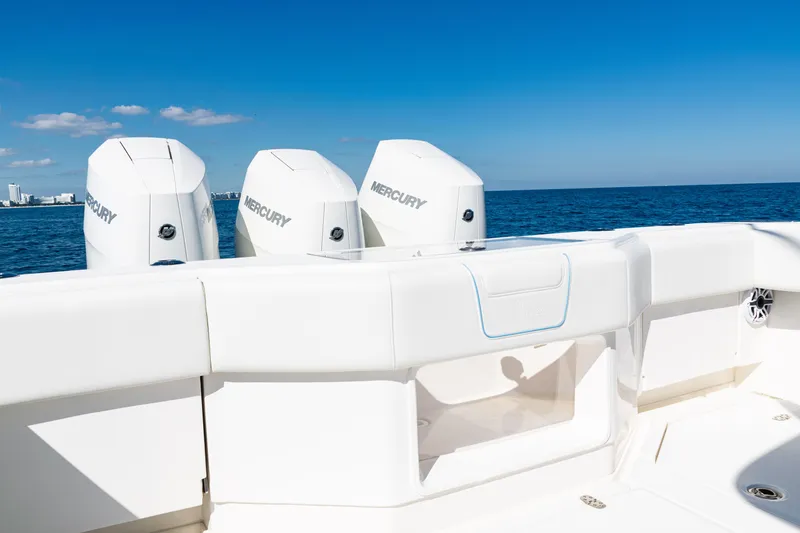 Slide: The Image of 2024 SeaVee 390B boat with triple Mercury engines on open ocean. - 46