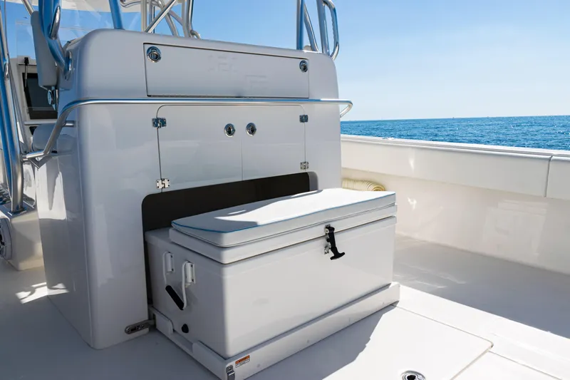 Slide: The Image of 2024 SeaVee 390B boat interior with storage compartment and ocean view. - 52