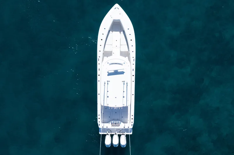 Slide: The Image of Aerial view of 2024 SeaVee 390B boat on clear blue water. - 58