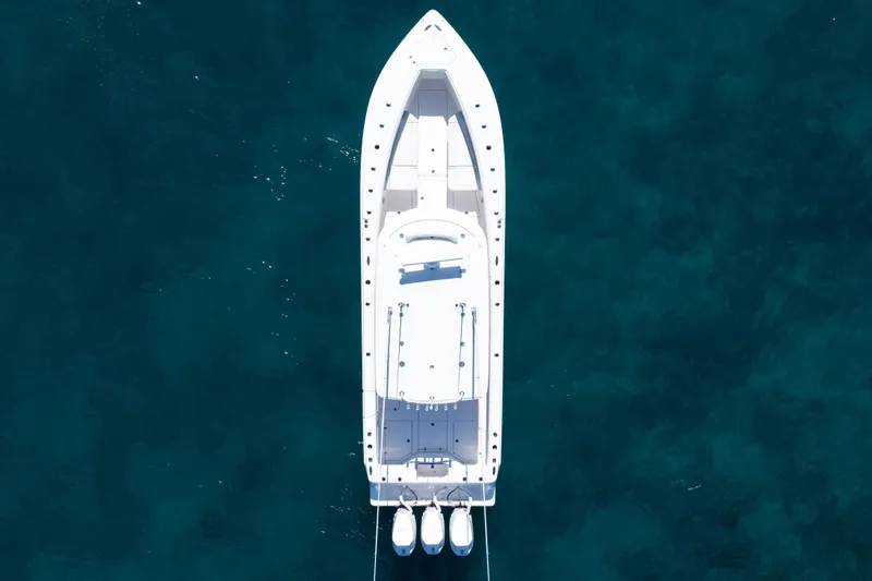 Slide: The Image of Aerial view of 2024 SeaVee 390B boat on clear blue water. - 59