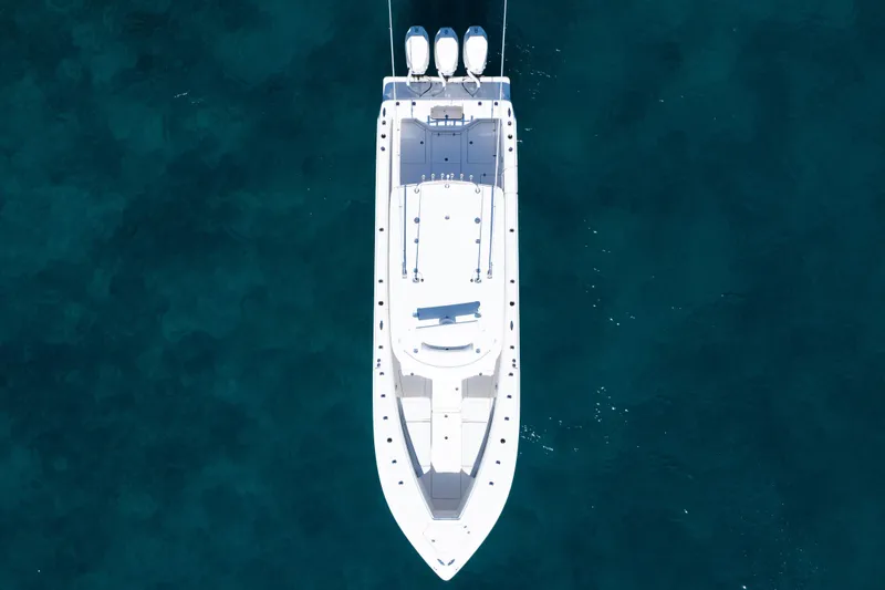 Slide: The Image of Aerial view of 2024 SeaVee 390B boat on clear blue water. - 60