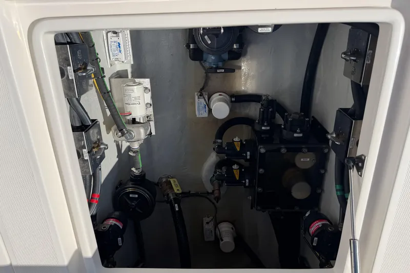 Slide: The Image of 2024 SeaVee 390B boat compartment showcasing intricate mechanical components and wiring. - 64