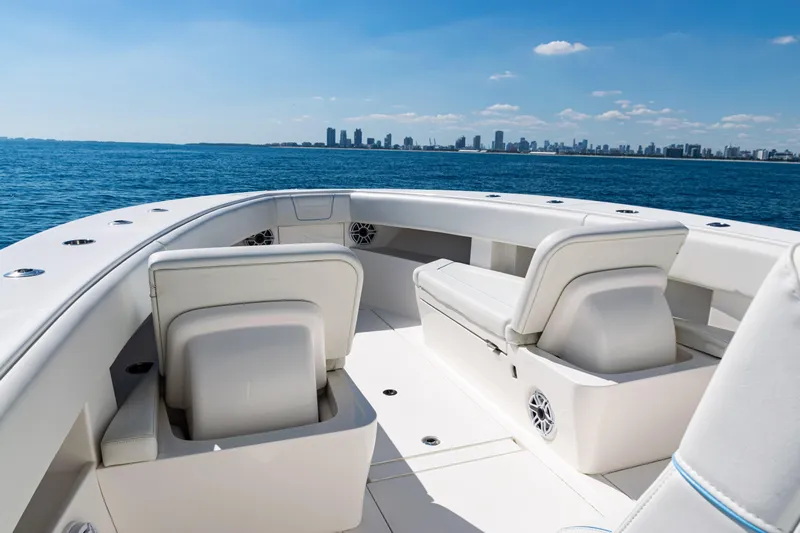 Slide: The Image of 2024 SeaVee 390B boat interior with city skyline in the background. - 9