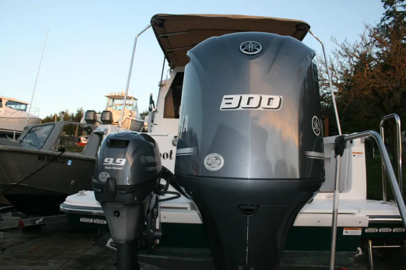 Slide: The Image of 2019 Ranger Tugs R-27 with Yamaha 300 and 9.9 outboard motors at dock. - 12