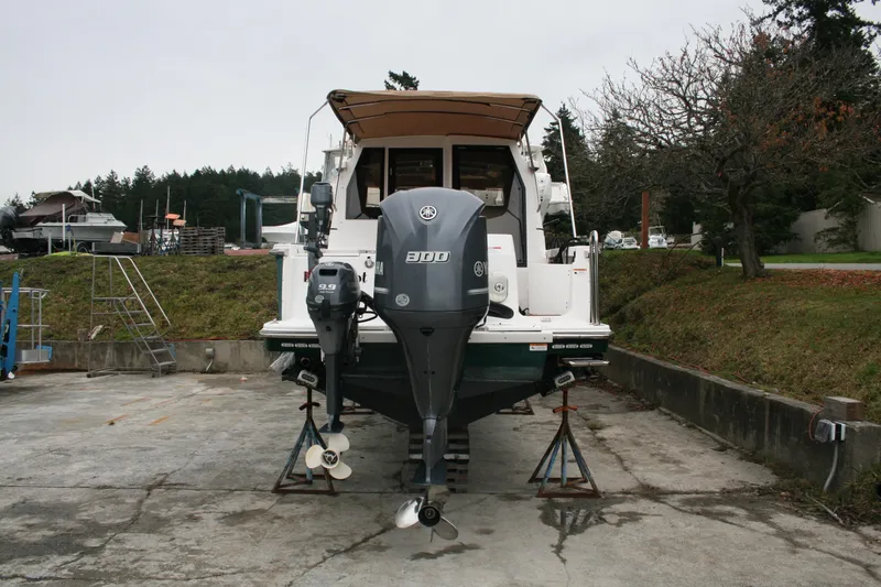 Slide: The Image of 2019 Ranger Tugs R-27 boat with Yamaha outboard motor on dry dock. - 2