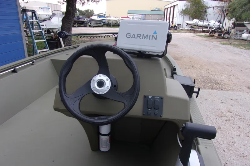 Slide: The Image of 2022 Tracker Grizzly 1648 MVX SC boat steering console with Garmin navigation system. - 5