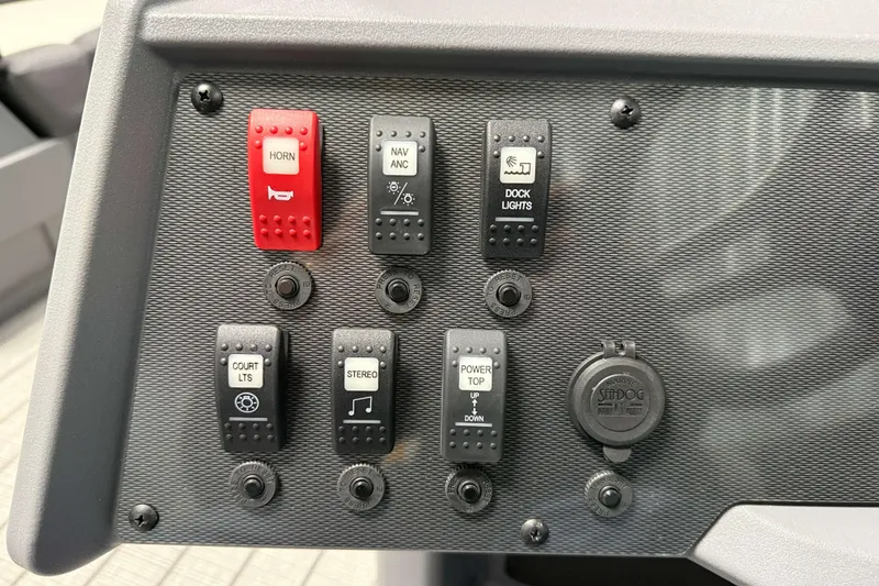 Slide: The Image of Control panel of 2026 Sylvan R-20 LZ DH boat with various switches. - 11
