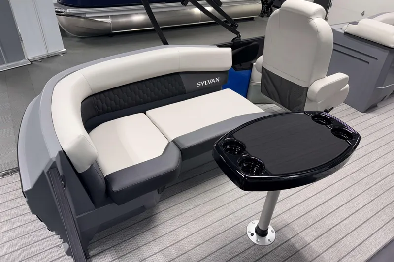 Slide: The Image of Luxurious seating area on 2026 Sylvan R-20 LZ DH pontoon boat with table and cup holders. - 15