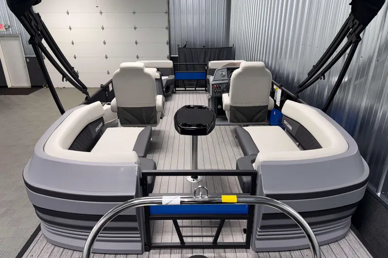 Slide: The Image of 2026 Sylvan R-20 LZ DH pontoon boat interior with modern seating and steering console. - 16
