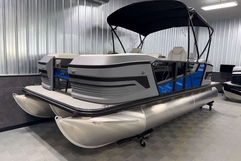 Slide: The Image of 2026 Sylvan R-20 LZ DH pontoon boat in showroom, featuring sleek design and modern amenities. - 17