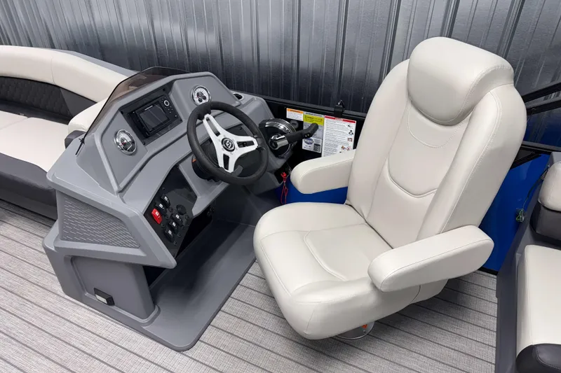 Slide: The Image of Captain's chair and helm of 2026 Sylvan R-20 LZ DH pontoon boat, featuring modern controls. - 8