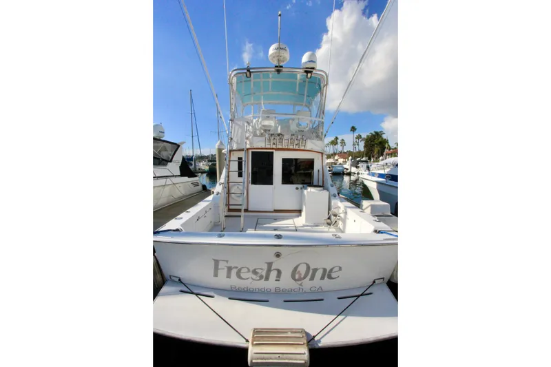 Slide: The Image of 1982 Bertram 35 Flybridge boat docked, rear view, "Fresh One" in Redondo Beach, CA. - 1