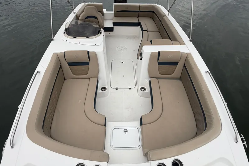 Slide: The Image of 2021 Hurricane SunDeck Sport 192 RL OB boat interior with beige seating and open layout. - 9
