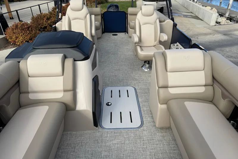 Slide: The Image of Luxurious interior of 2026 Premier 230 SunSation RF pontoon boat with plush seating. - 11