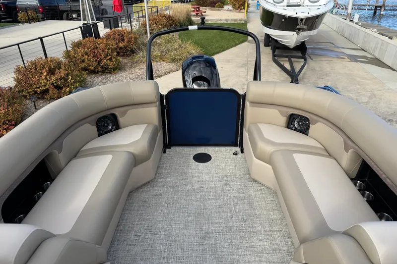 Slide: The Image of 2026 Premier 230 SunSation RF pontoon boat interior with beige seating and modern design. - 13