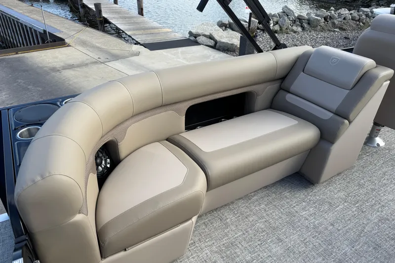 Slide: The Image of Luxurious seating on 2026 Premier 230 SunSation RF pontoon boat at dockside. - 15