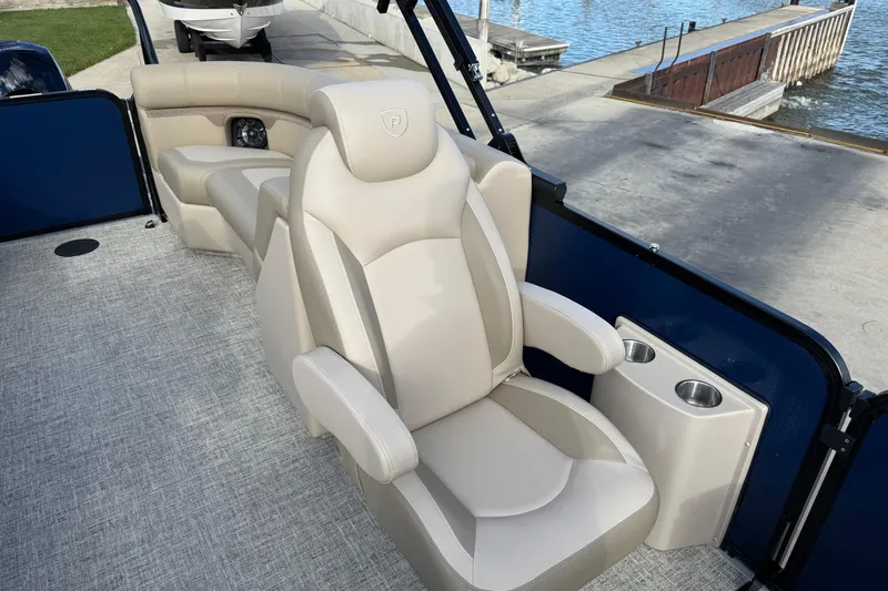 Slide: The Image of Luxurious seating on 2026 Premier 230 SunSation RF pontoon boat at dockside. - 19